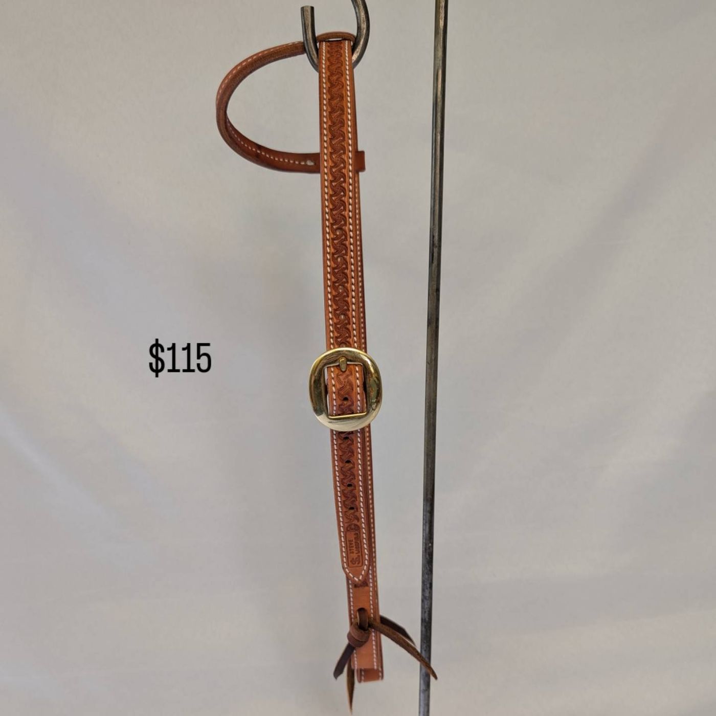 Tan basket-stamped headstall with brass buckle