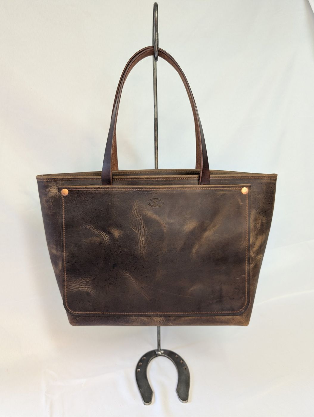 Dark brown distressed zipper tote, front view