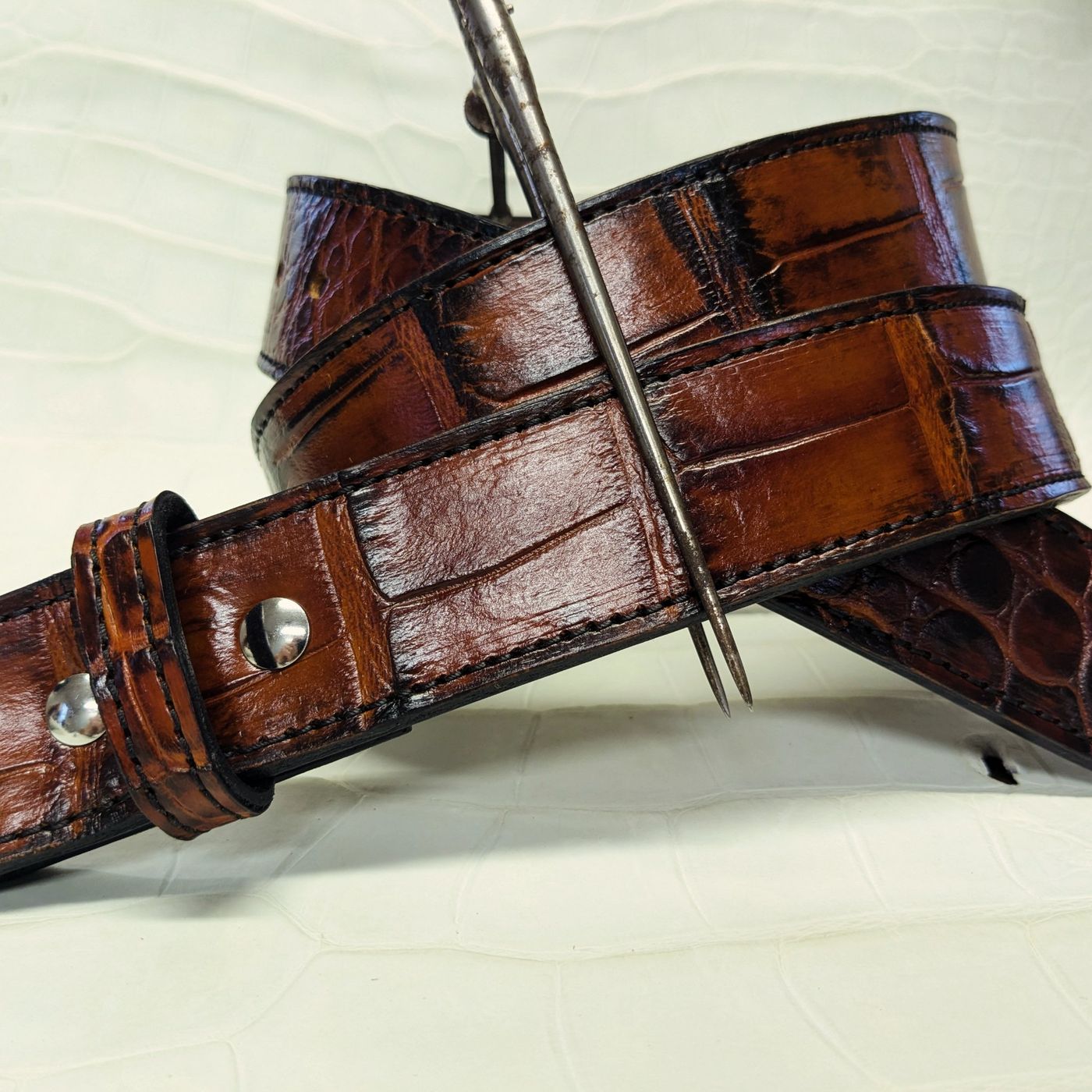 Brown gator-embossed leather belt