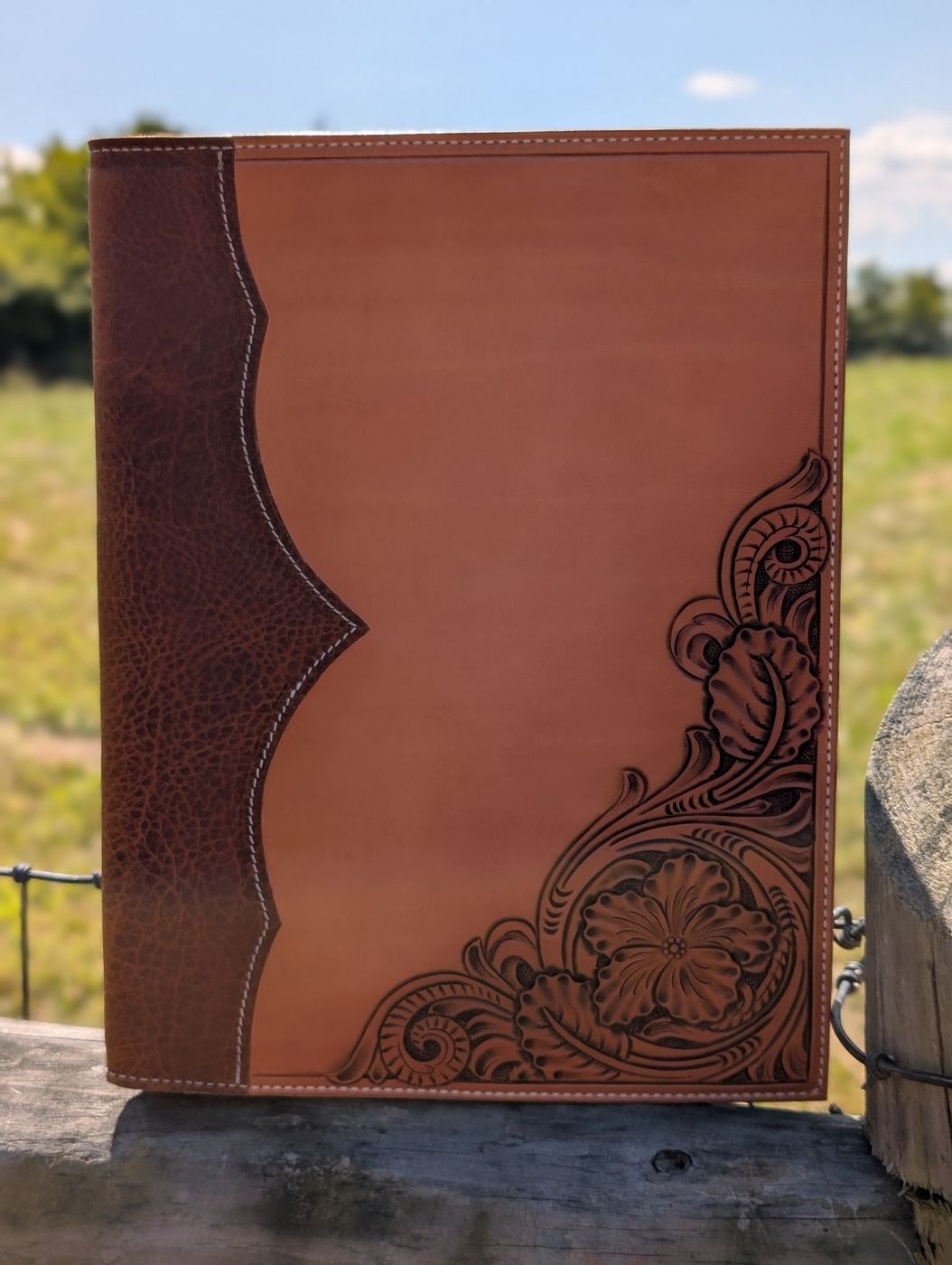 Floral carved leather padfolio, front view
