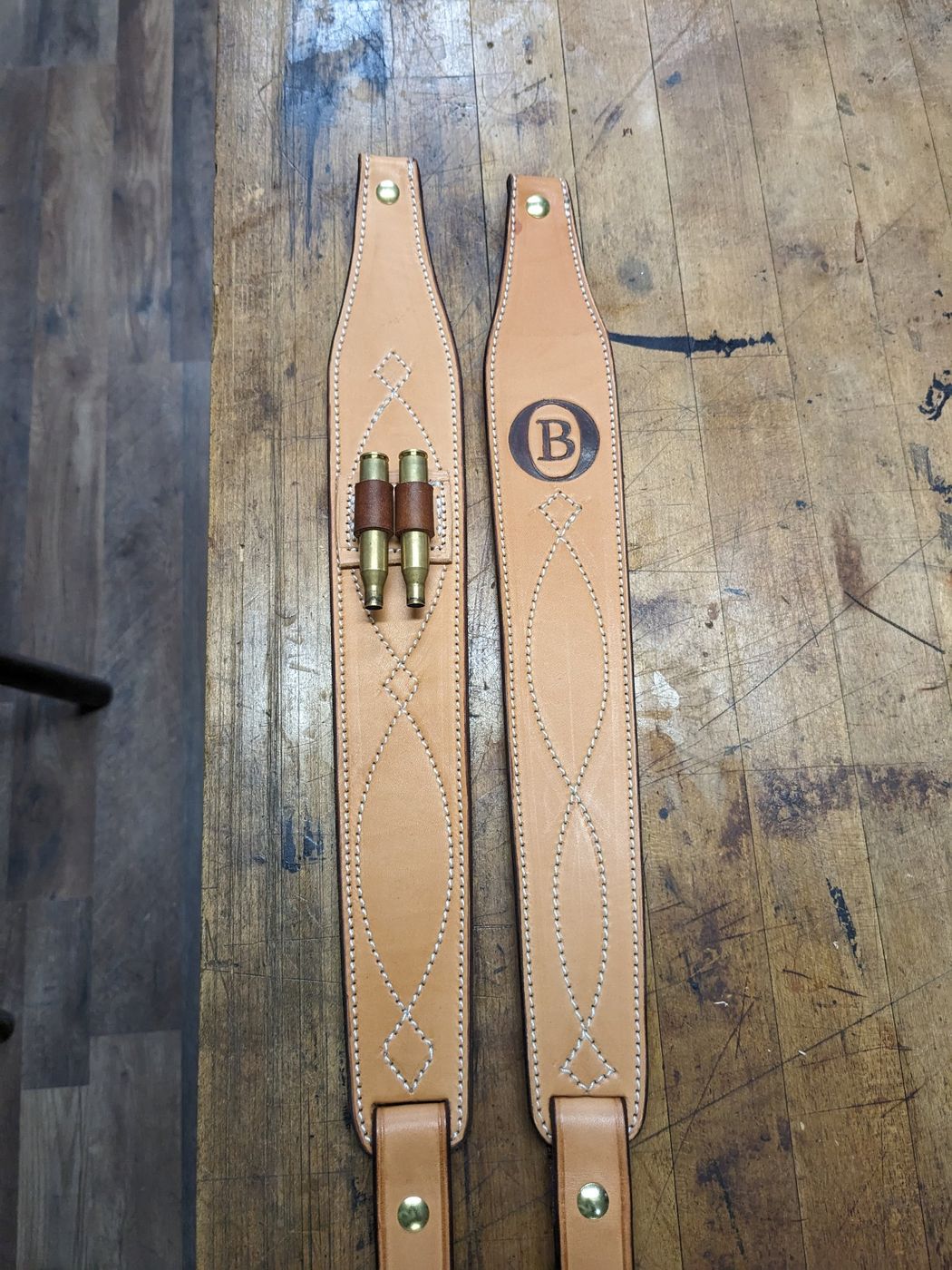 Pair of leather rifle slings with B brand